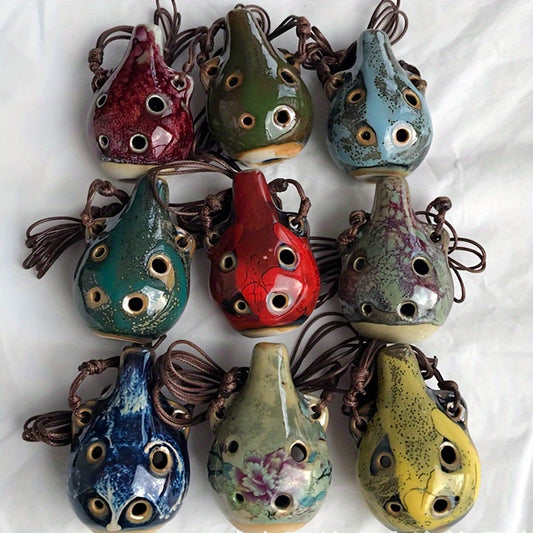 Handcrafted ceramic ocarina with glazed finish in random colors. Vintage style with 6 holes, both decorative and musical.