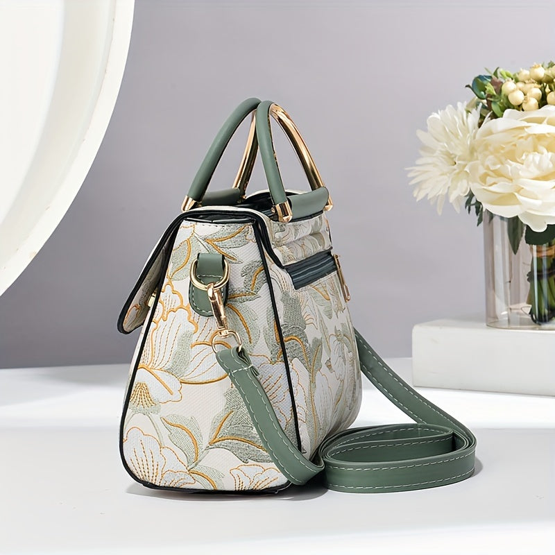 Large capacity floral embroidered crossbody bag with zipper closure and polyester lining. Versatile commuter handbag with luxurious, fashionable design and edge paint detail. Available in