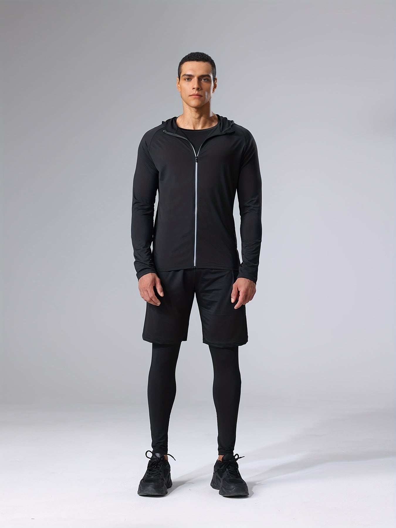 Polyester and elastane blend athletic set includes crew neck hoodie and skinny fit bottoms for running, fitness, cycling, and outdoor activities.