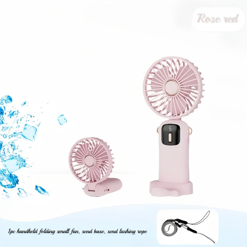 Sleek and stylish white and rose gold Compact & Portable USB Rechargeable Mini Fan with Neck Strap. Perfect for use in the office, classroom, or while traveling. Features a 1200mAh Lithium Battery, desk stand, and includes a power cable for convenient