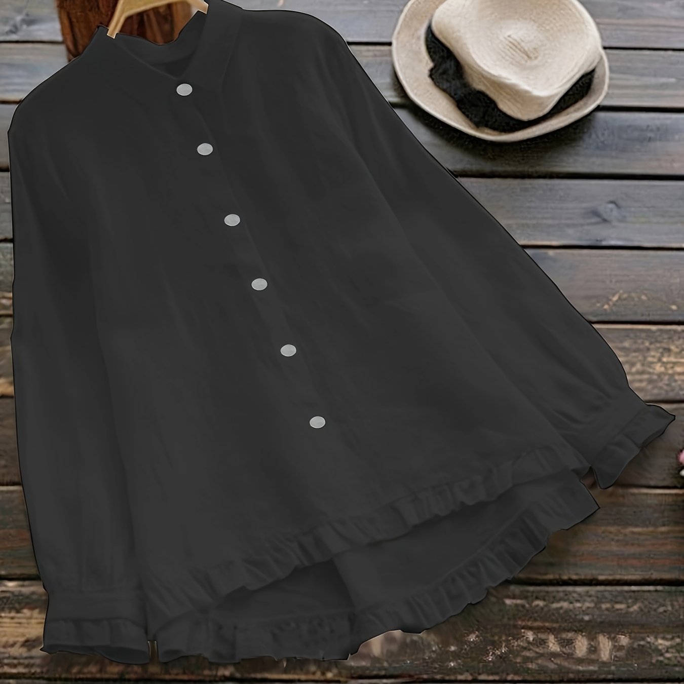 Loose-fitting collared shirt in solid color with front buttons and lace trim.