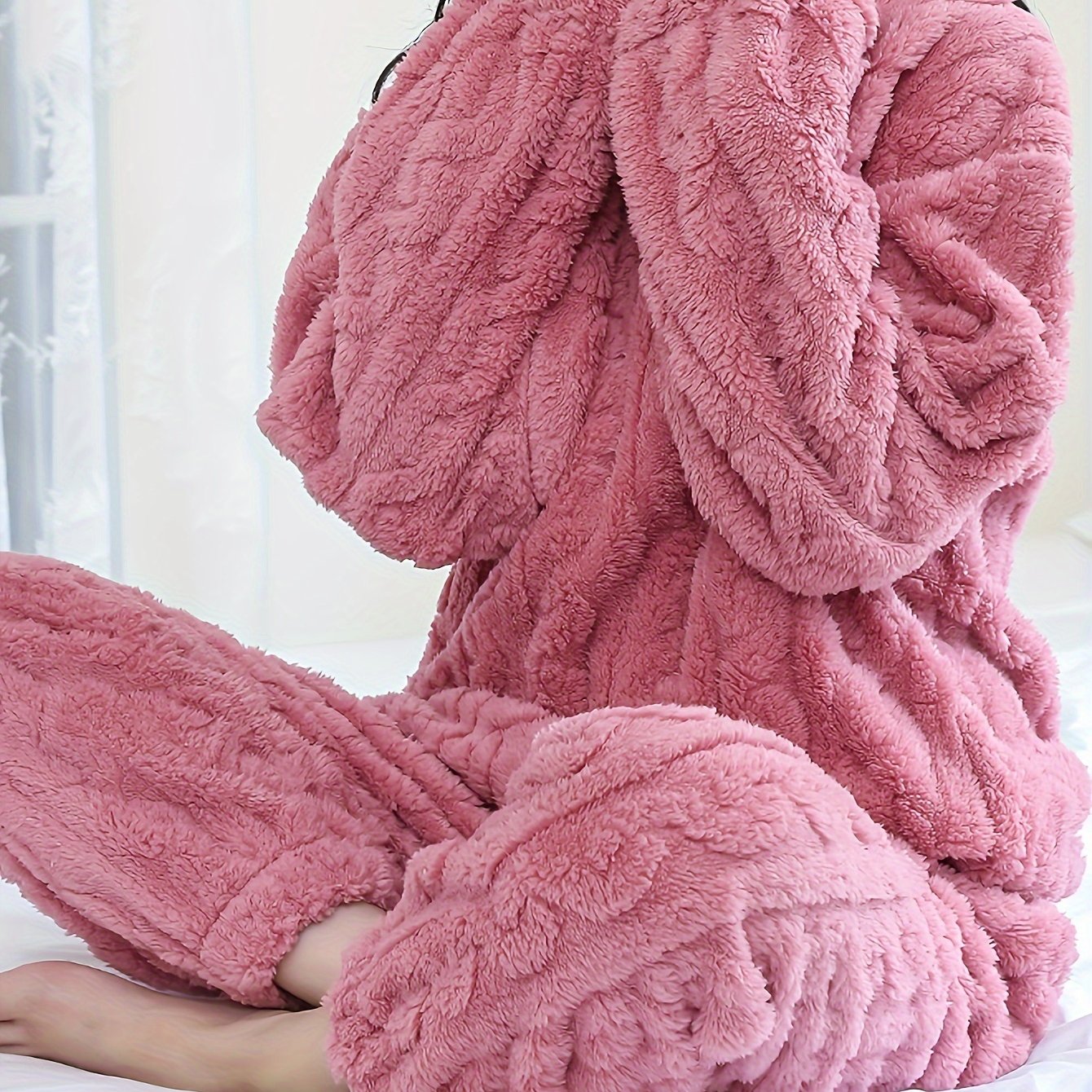 Soft pink fleece pajama set for women, long sleeves, round neck, warm and cozy for fall/winter, easy care machine washable.