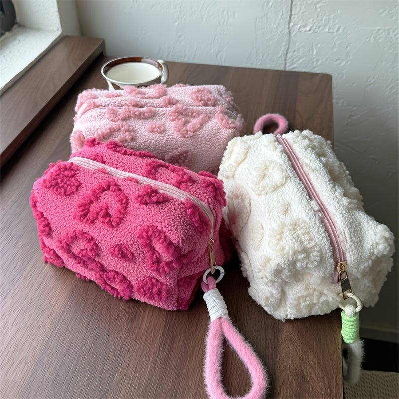 Heart-shaped hand carry bag for women, ideal for on-the-go skin care and cosmetic storage.