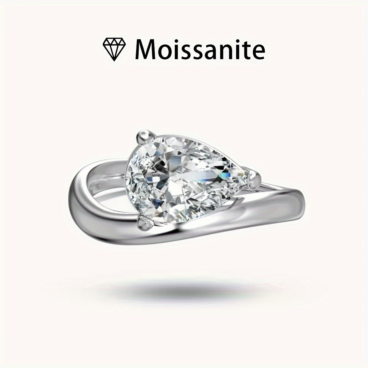 Stunning 2ct Pear-Shaped Moissanite Engagement Ring crafted in S925 Sterling Silver, ideal for weddings and anniversaries. Comes with a certificate and luxurious gift box, perfect for your special day.