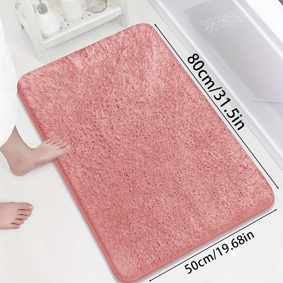 Soft and sumptuous purple bath mat offering luxury feel - highly absorbent, non-slip and fade-resistant, ideal for bathroom, bedroom and laundry room décor. Made from durable polyester, easy to clean.