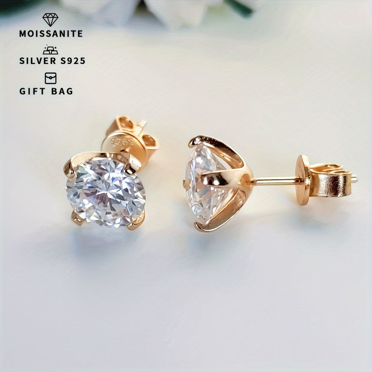 Elegant and fashionable women's jewelry - a pair of S925 silver earrings with platinum and gold plating, featuring round white moissanite stones in a simple 4-prong setting. Available in sizes ranging from 0.3CT to 3CT.