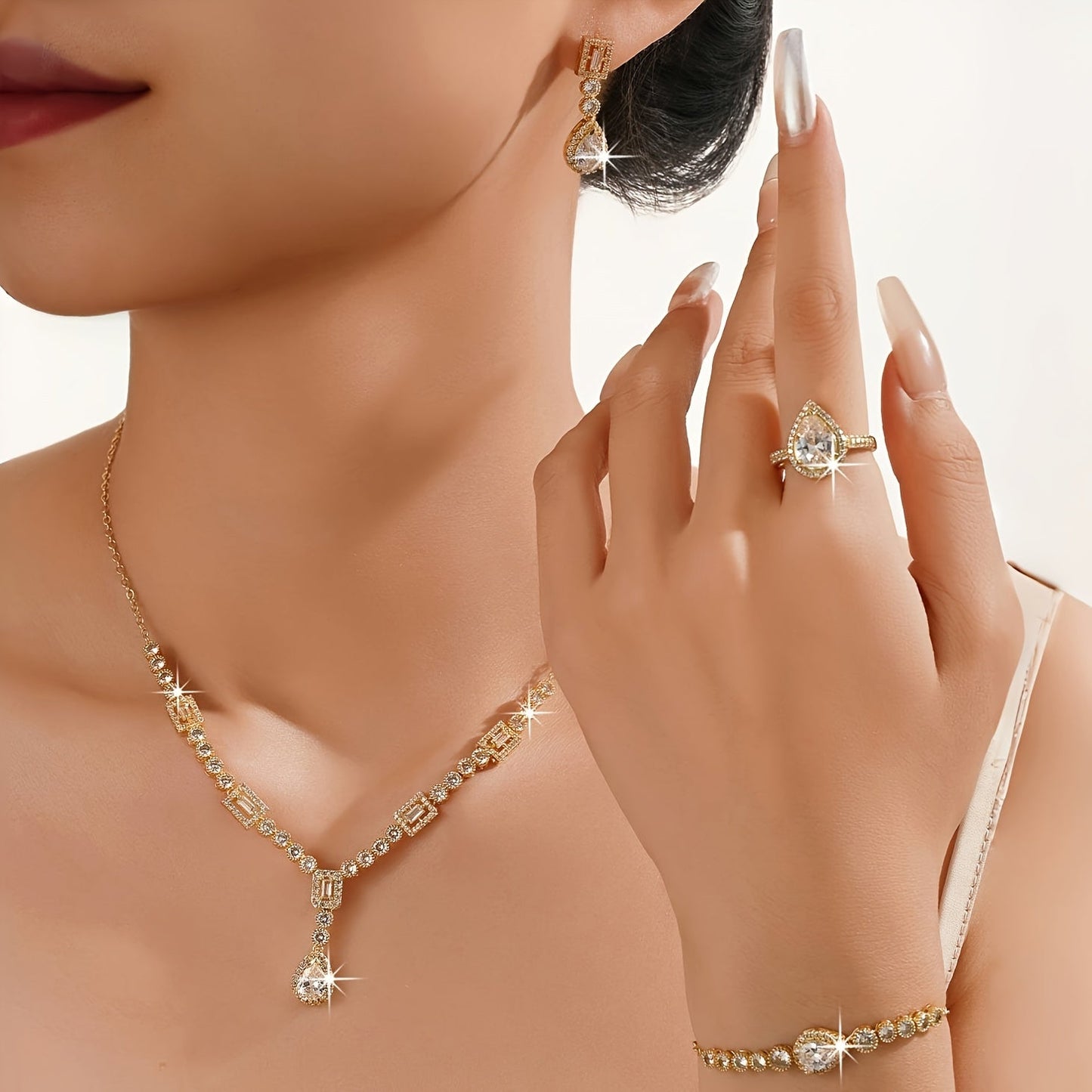 Luxury Jewelry Set Featuring 5 Pieces, Crafted from 18K Golden Plated Copper with Synthetic Cubic Zirconia Stones in a Geometric Teardrop Design. Includes Necklace, Earrings, Ring, and Bracelet, Perfect for Both Daily Wear and Wedding Occasions.