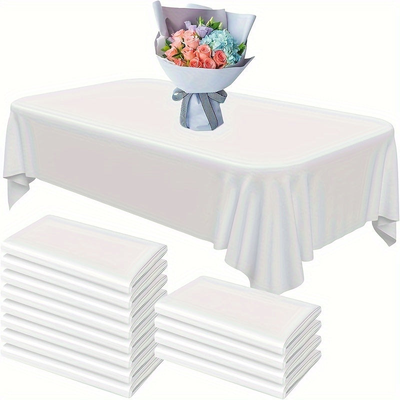 White Disposable Tablecloth - 12 pieces, measures 137x274cm. Waterproof and oil-resistant plastic, perfect for rectangular tables. Ideal for parties, weddings, family picnics, and birthdays.