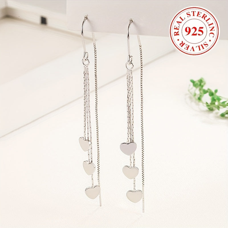 Elegant and simple, these glossy heart chain tassel dangle earrings are made of hypoallergenic sterling silver (925). The perfect delicate gift for a female, they will add a touch of elegance to any outfit.