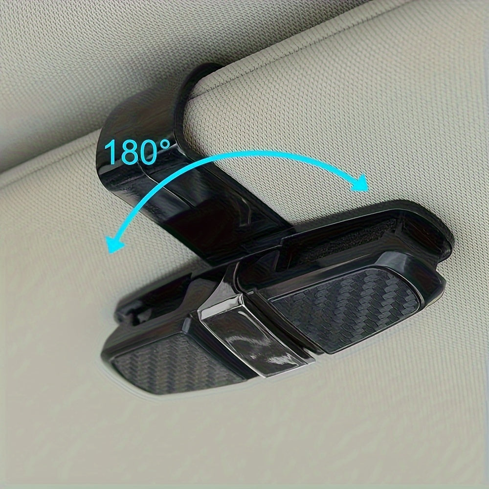 Car visor sunglasses holder with ticket card clamp.