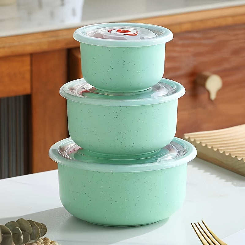 Set of three food storage containers made from wheat straw material, featuring flip top lids. Versatile, eco-friendly, hand wash recommended, microwave-safe, round bowls with sealable lids for preserving food.