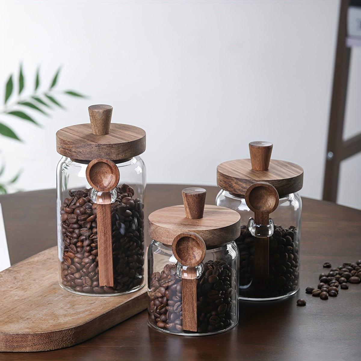 Glass containers for storing coffee, tea, grains, snacks, and pickles.