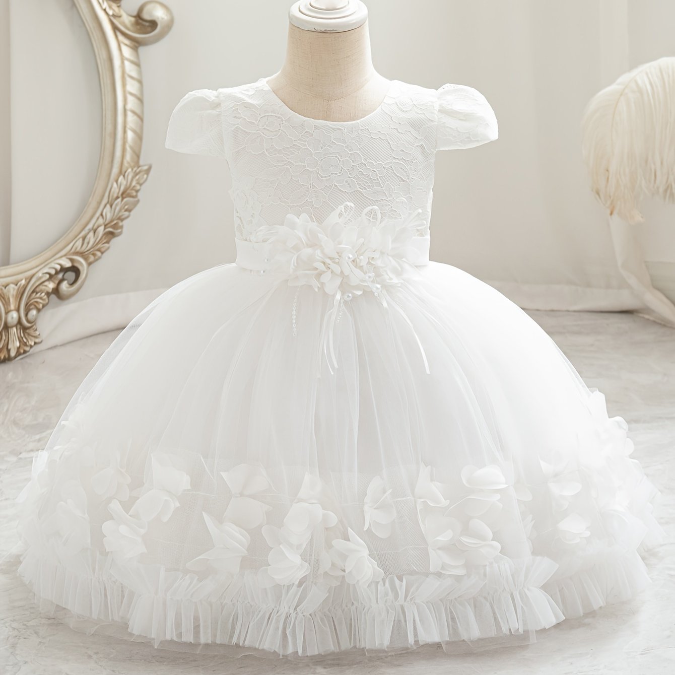 Baby's floral tulle princess dress with lace sleeves for formal occasions.