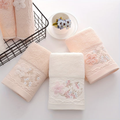 2 Cotton embroidered hand towels with quick-drying, absorbent material for home bathrooms.