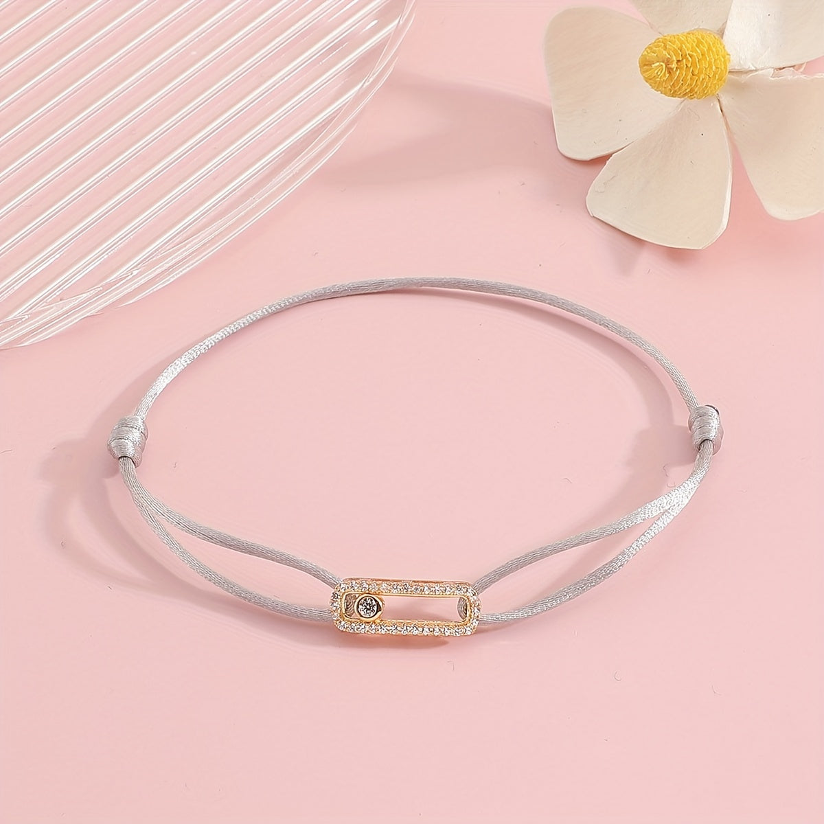 A stylish and timeless charm bracelet designed for women, featuring adjustable sizing and movable zirconia accents. This premium accessory is the perfect gift for any fashionable woman who appreciates high-quality jewelry.