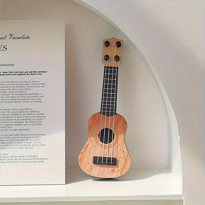 Mini playable uke instrument figurine made of plastic for home and office decor, ideal gift for music enthusiasts.