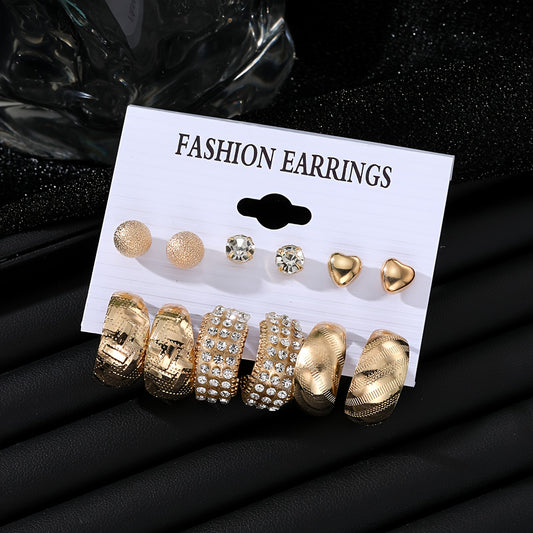 Punk style 6-pair set of metal earrings with textured and heart studs. Made of zinc alloy with rhinestones and stainless steel posts. Versatile for daily and party wear. Perfect gift