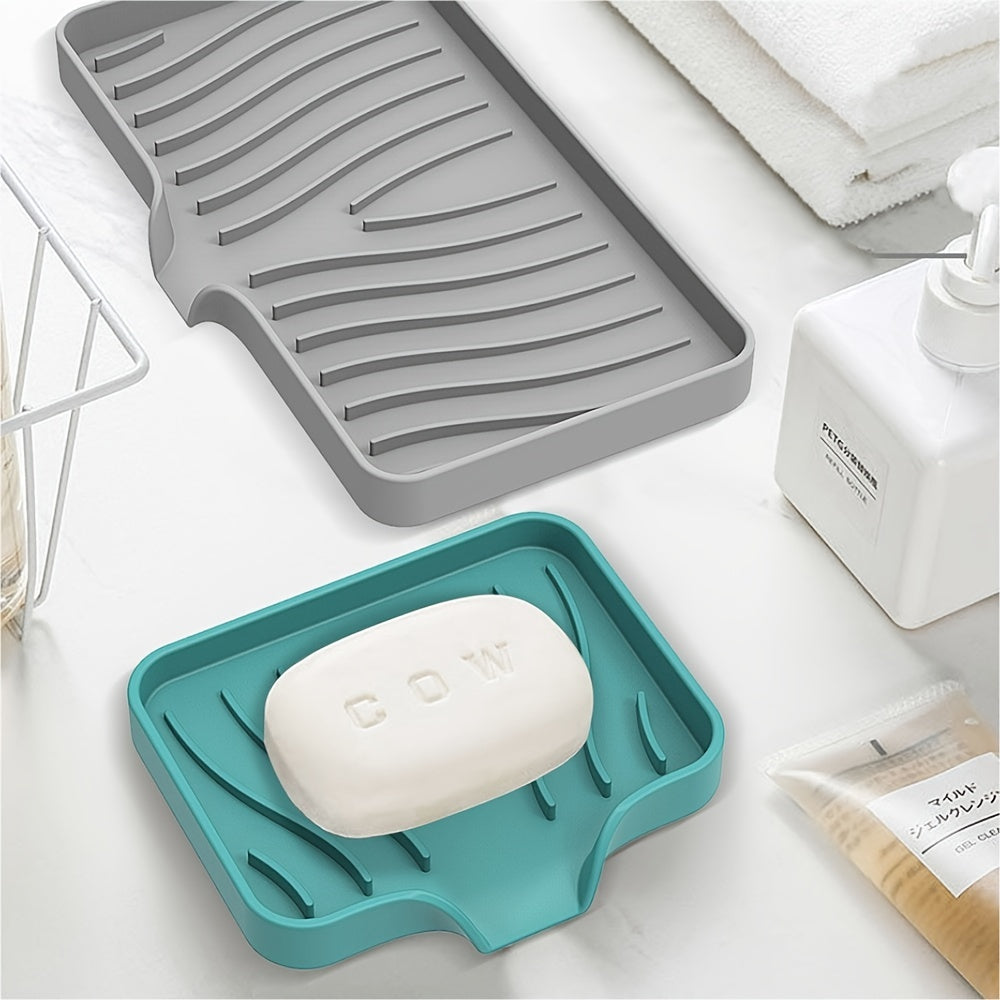 Silicone soap dish with self-draining design for countertop or sink storage in bathroom.