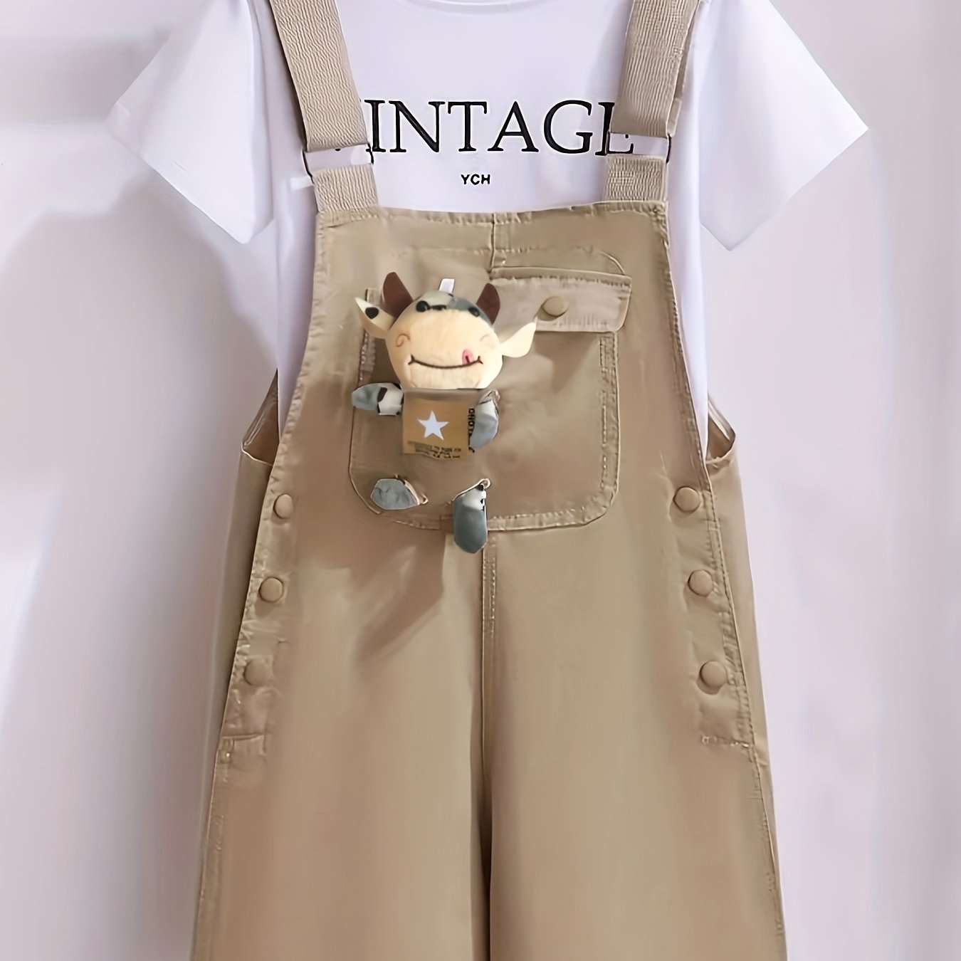 Girls' summer outfit with trendy suspenders and lightweight overalls for outdoor wear.