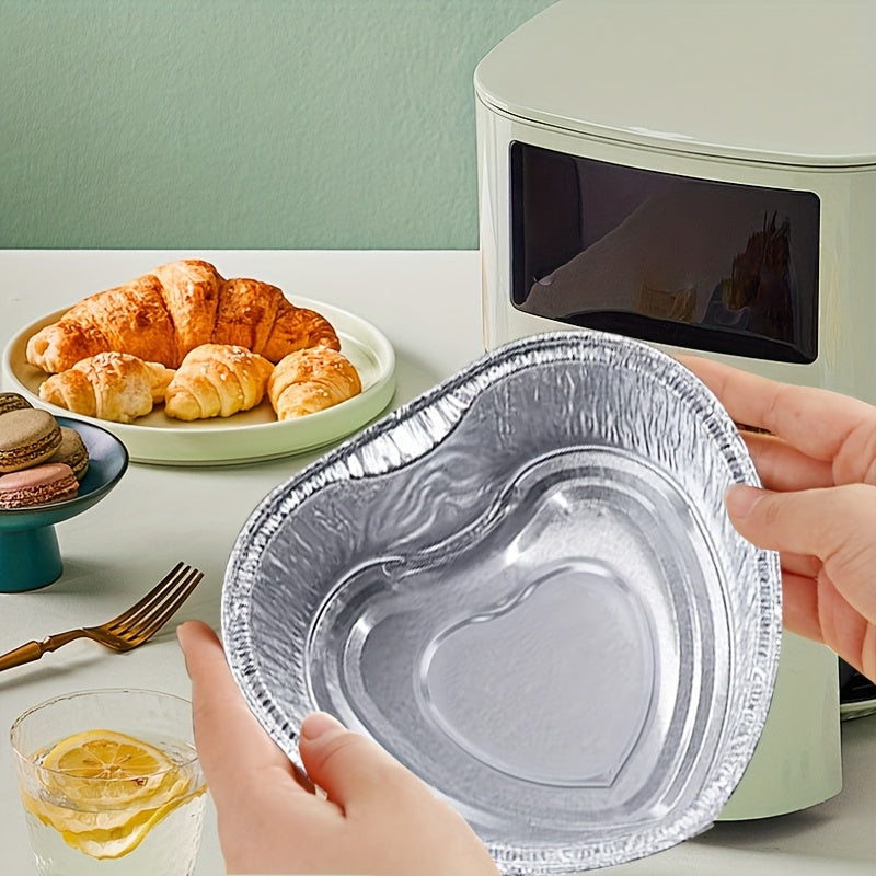 12 heart-shaped aluminum foil pans, suitable for baking, roasting, and insulating. These disposable and recyclable pans are chemical-free, making them ideal for holiday meals, food preparation, cakes, and oven use.