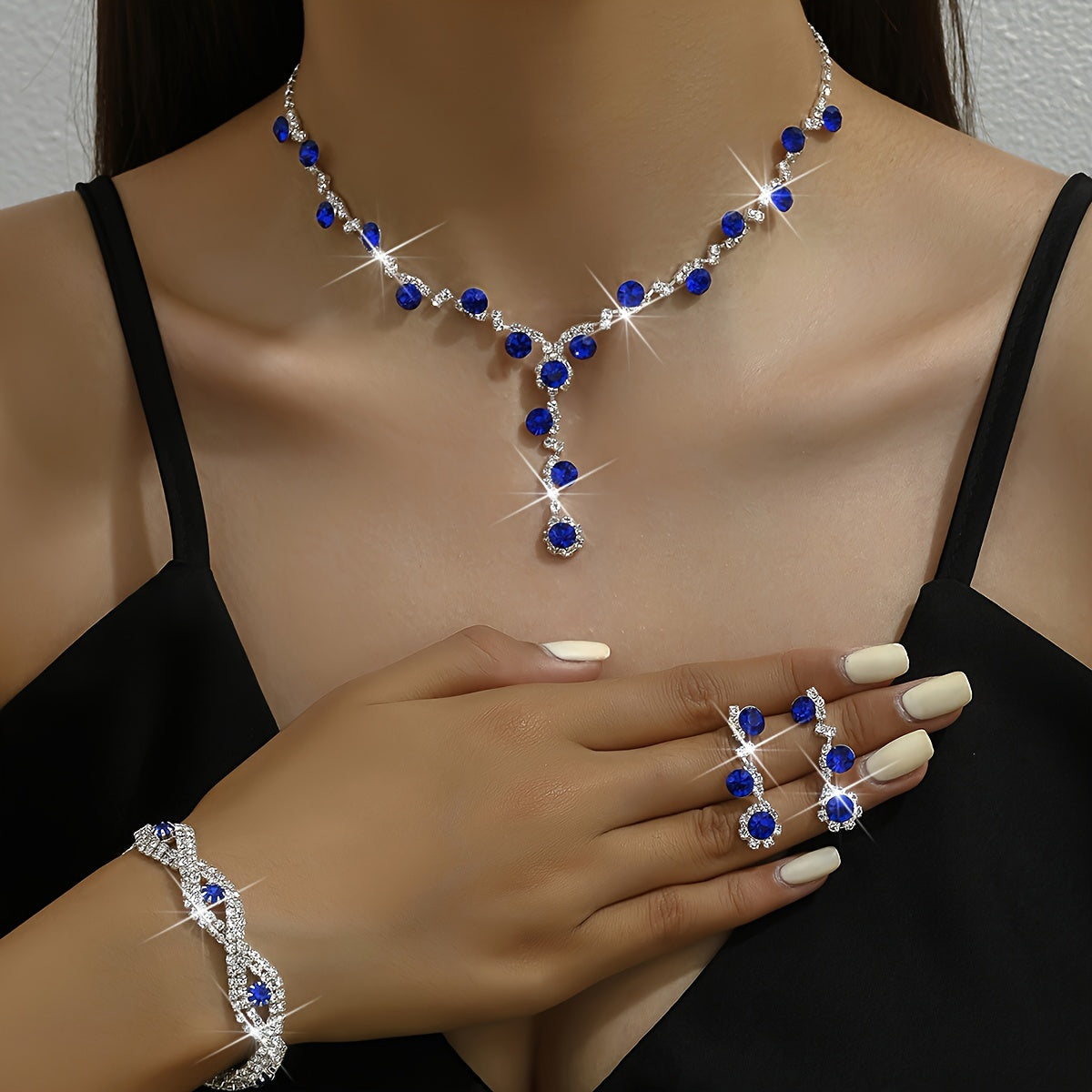 Stunning Jewelry Set in Sapphire Blue - Featuring Silvery-Plated Necklace, Earrings & Bracelet adorned with Synthetic November Birthstone - Ideal for Special Occasions and Celebrations