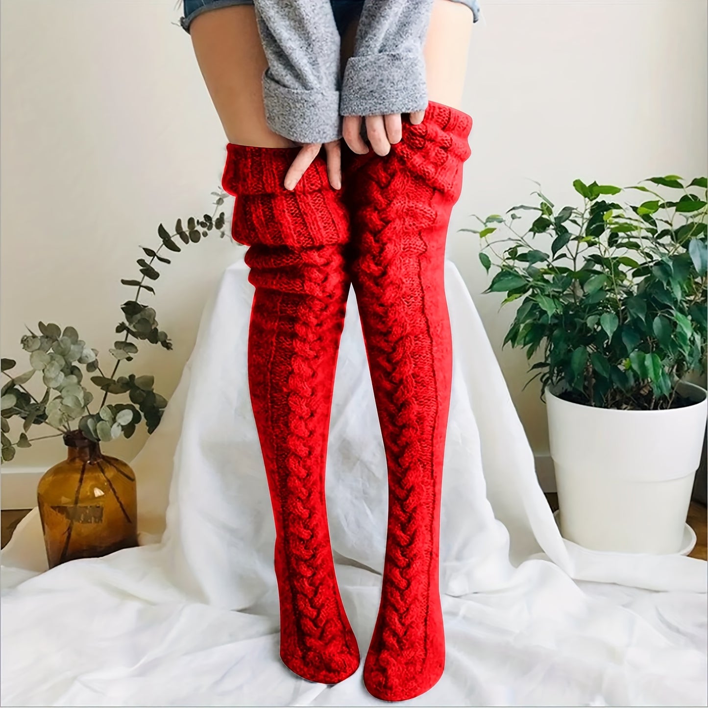 Warm thigh-high knitted socks for women.