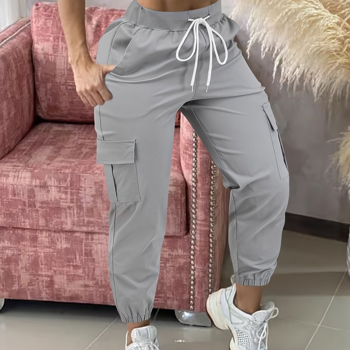 Women's casual cargo pants made of polyester with a drawstring waist.