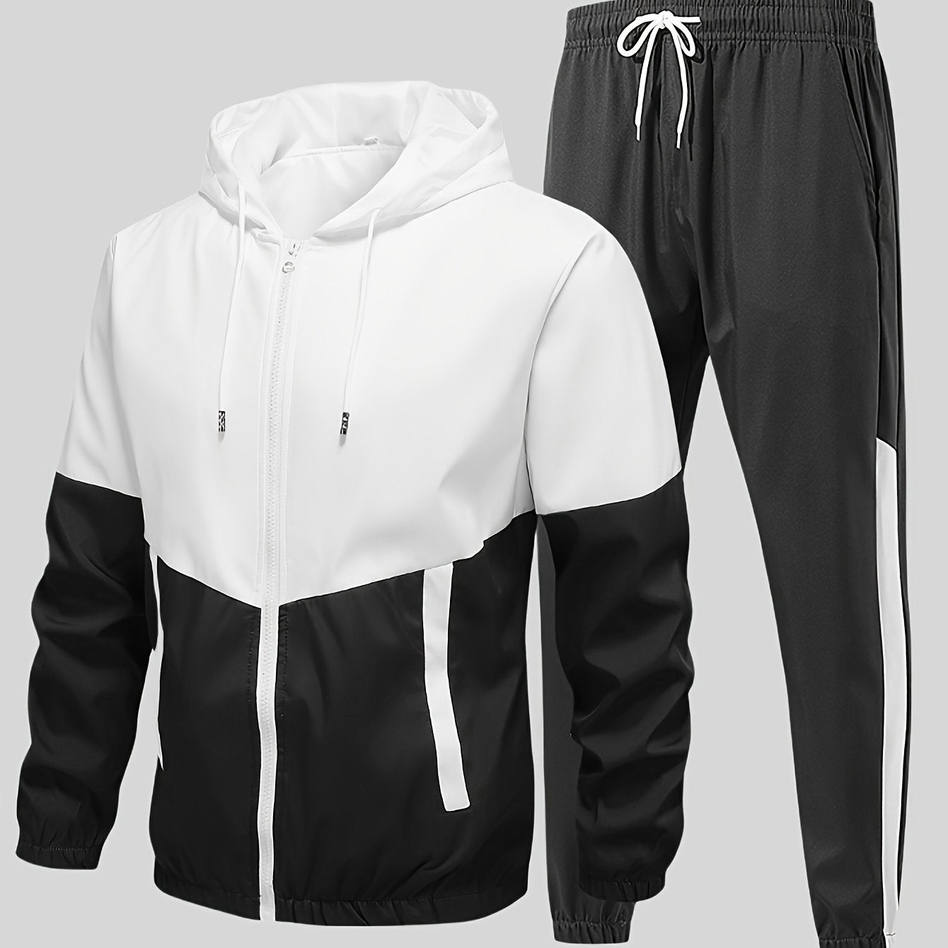 Casual men's sports suit with hooded jacket and pants, featuring a trendy color block design. Made of polyester with slight stretch, drawstring detail, and regular fit.