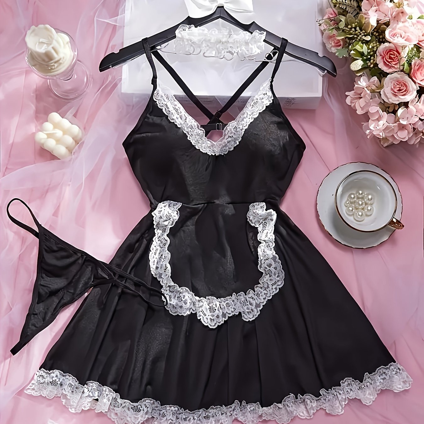 Seductive four-piece set with maid uniform, lingerie, leg rings, necklace, and underwear.