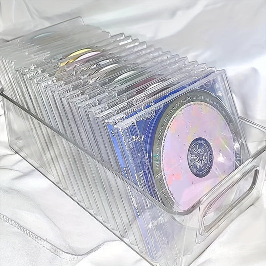 The Clear Acrylic CD/DVD Storage Basket is a sturdy and stylish solution for storing your media collection. This space-saving display rack can hold up to 20 standard cases, making it perfect for organizing your albums and games. Its durable construction