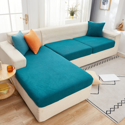 Durable sofa cover protects furniture from spills and stains.