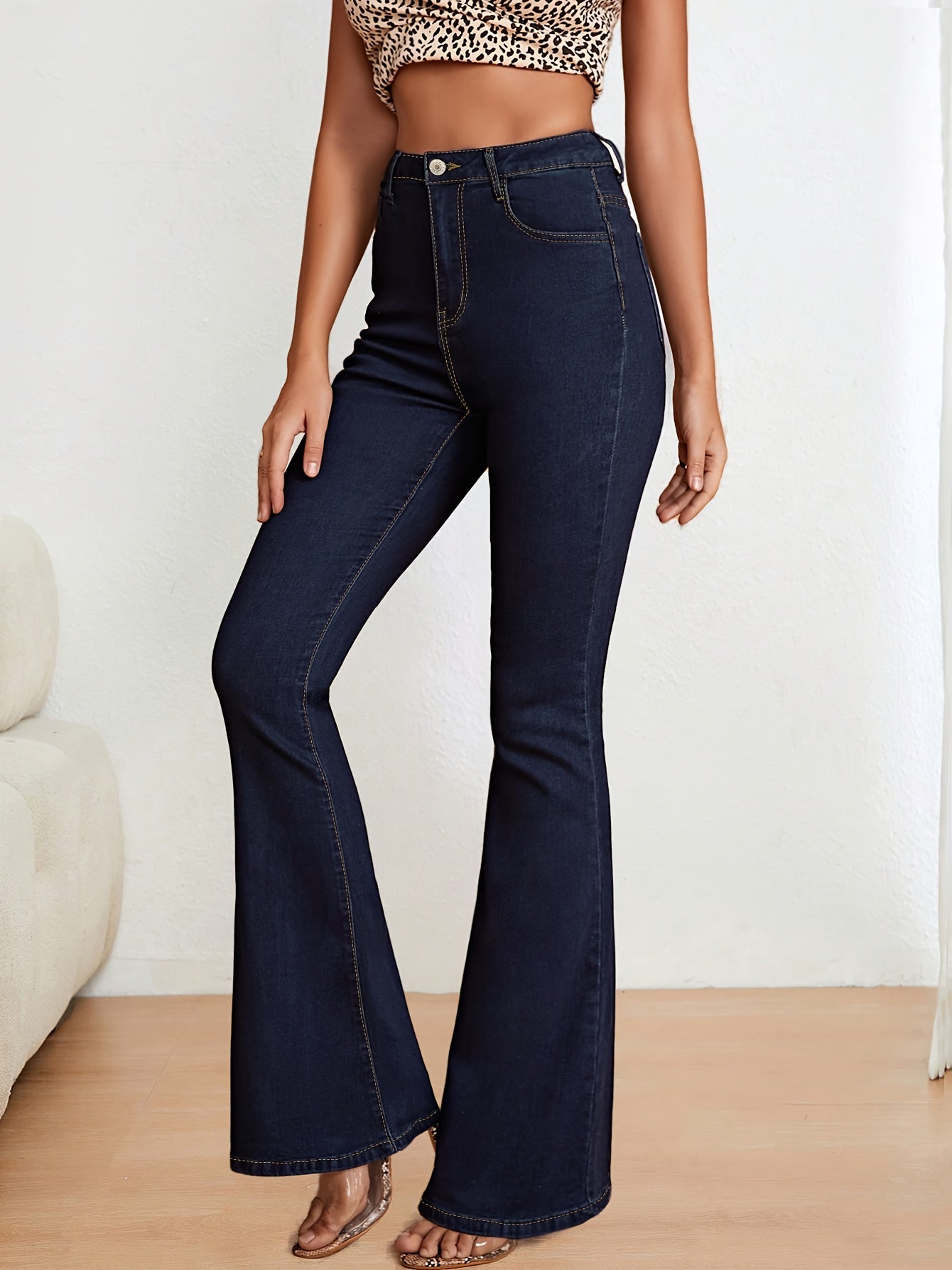 Blue stretch denim flare jeans for women, slim fit, high-waisted with button closure, machine washable.