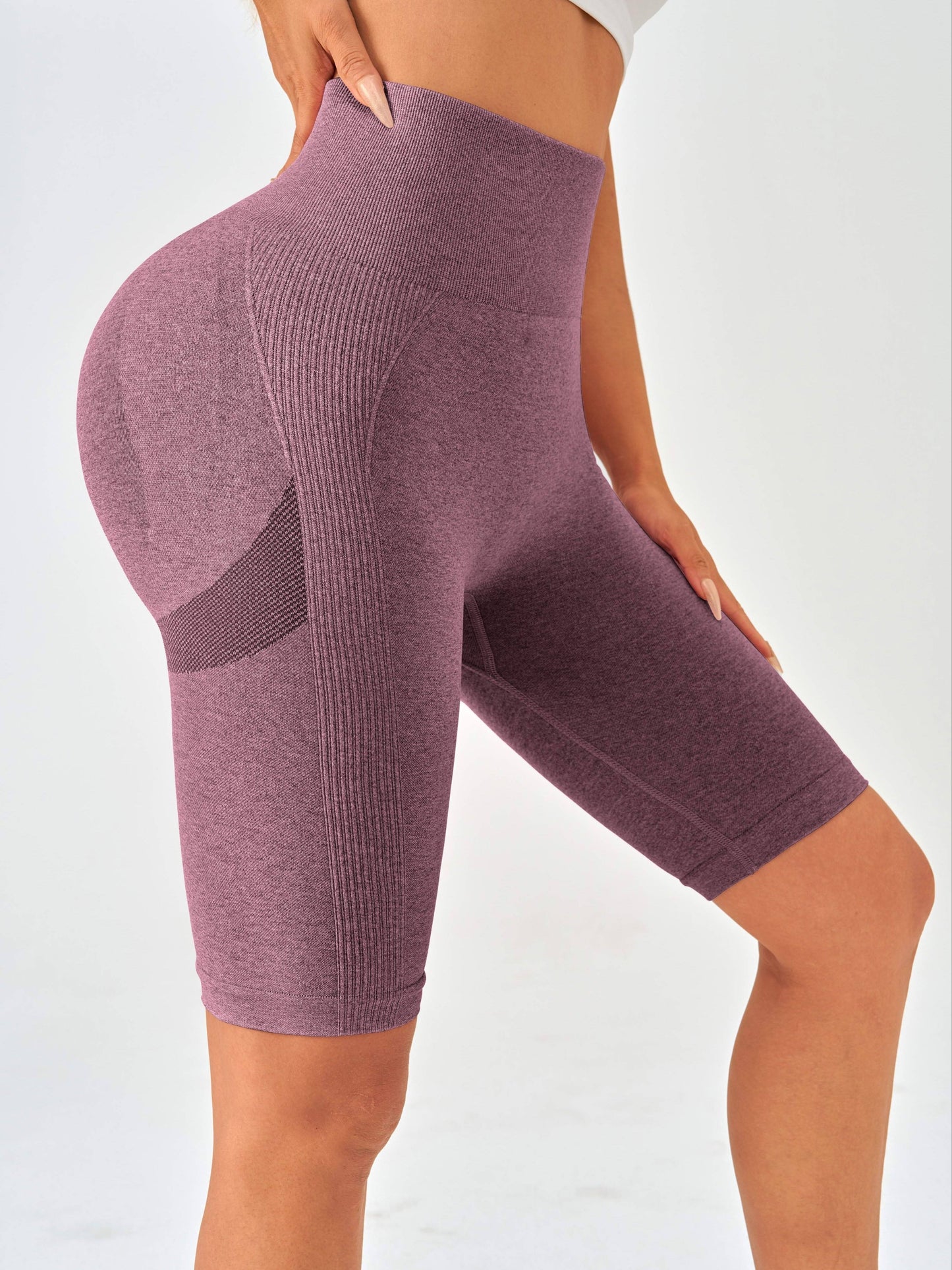 Solid color knitted yoga fitness pants for women with high waist, hip lift, and tight belly.