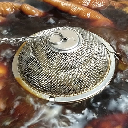 Introducing the latest stainless steel seasoning ball for enhancing the flavor of soups and stews, complete with a special compartment for brewing tea.