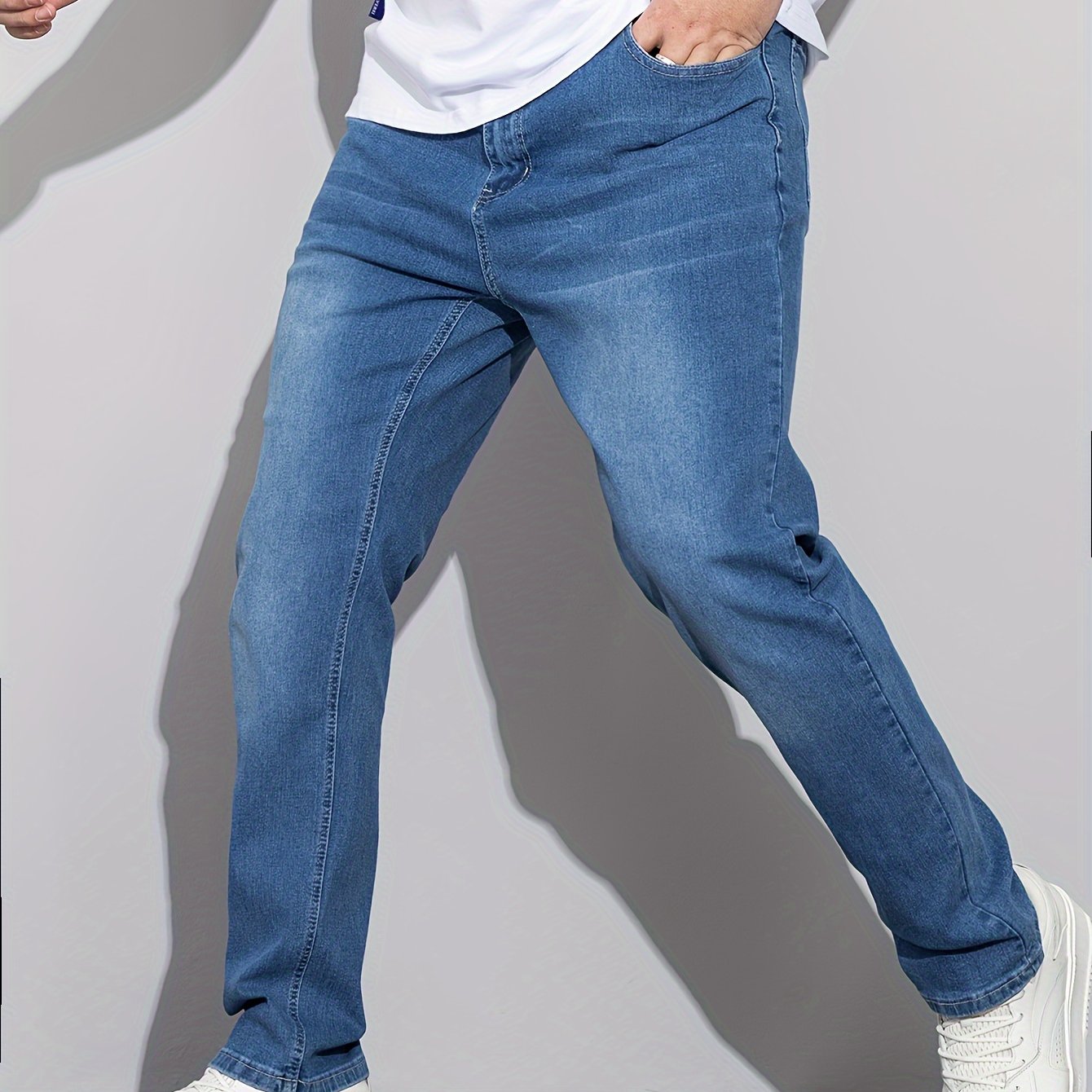 Stylish men's plus size denim pants for casual street style in spring and fall.