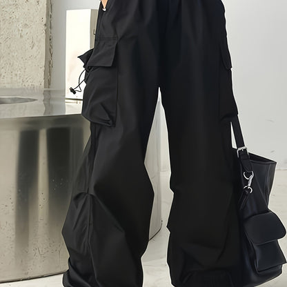 Wide leg cargo pants with flap pockets, drawstring closure. Perfect for spring and summer. Women's casual clothing.