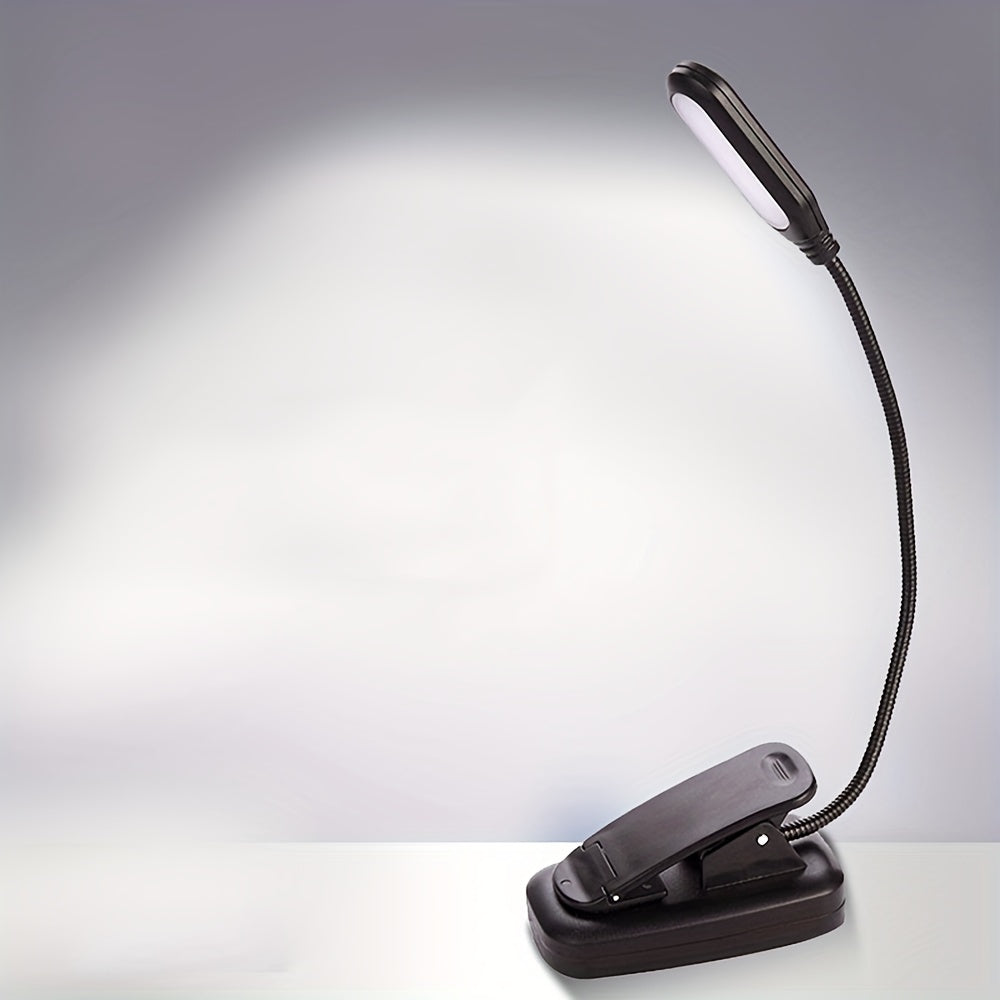 Portable LED book light with adjustable arm, push button control, and polished finish. Battery not included.