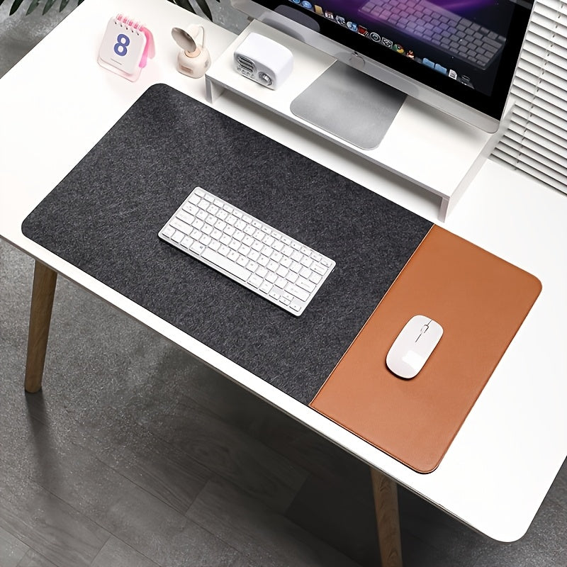 Large gaming mouse pad with anti-slip felt and faux leather, suitable for e-sports, writing, and office use. Includes wrist support and keyboard pad.