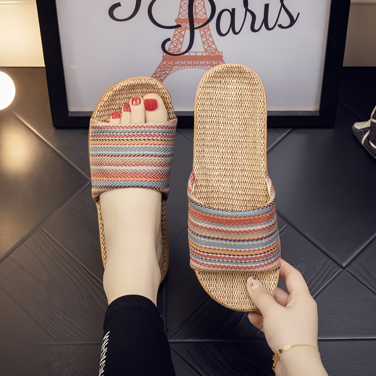 Comfortable home slippers with a striped pattern and casual open toe design.