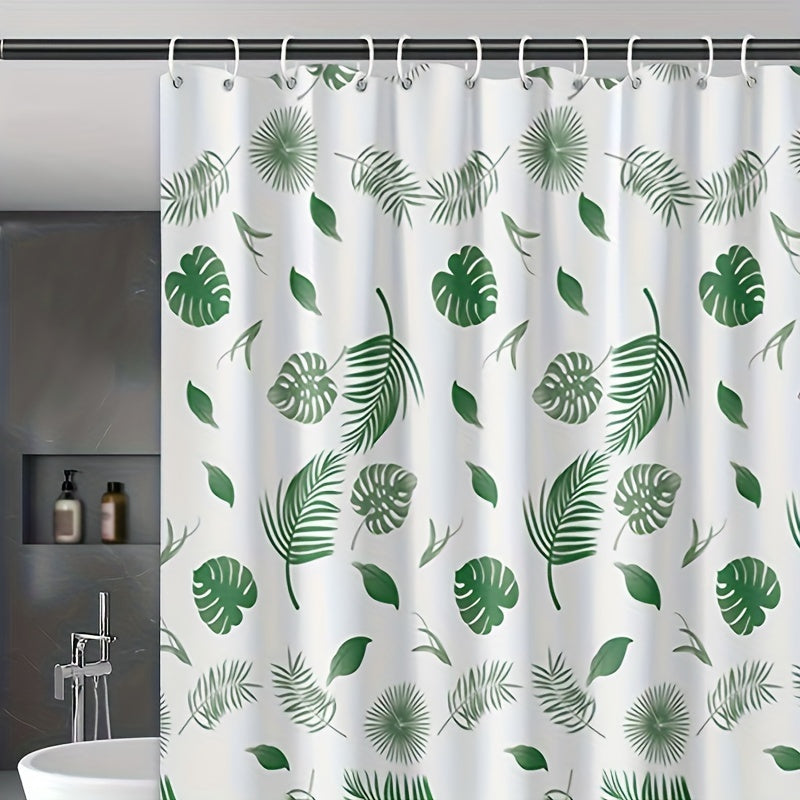 Tropical leaf bath liner made of water-resistant polyethylene, featuring a leaf pattern. Includes easy-hang white plastic hooks for all-season bathroom decor.