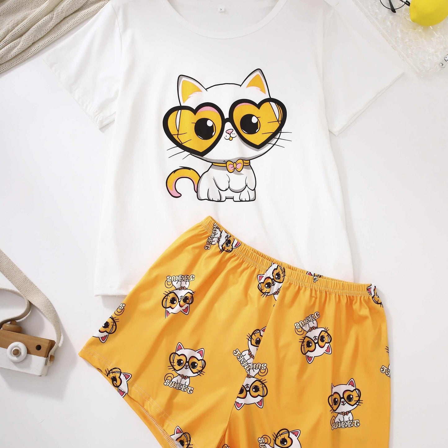 Cute cat print lounge set for women, includes short sleeve top and shorts for comfortable fit.