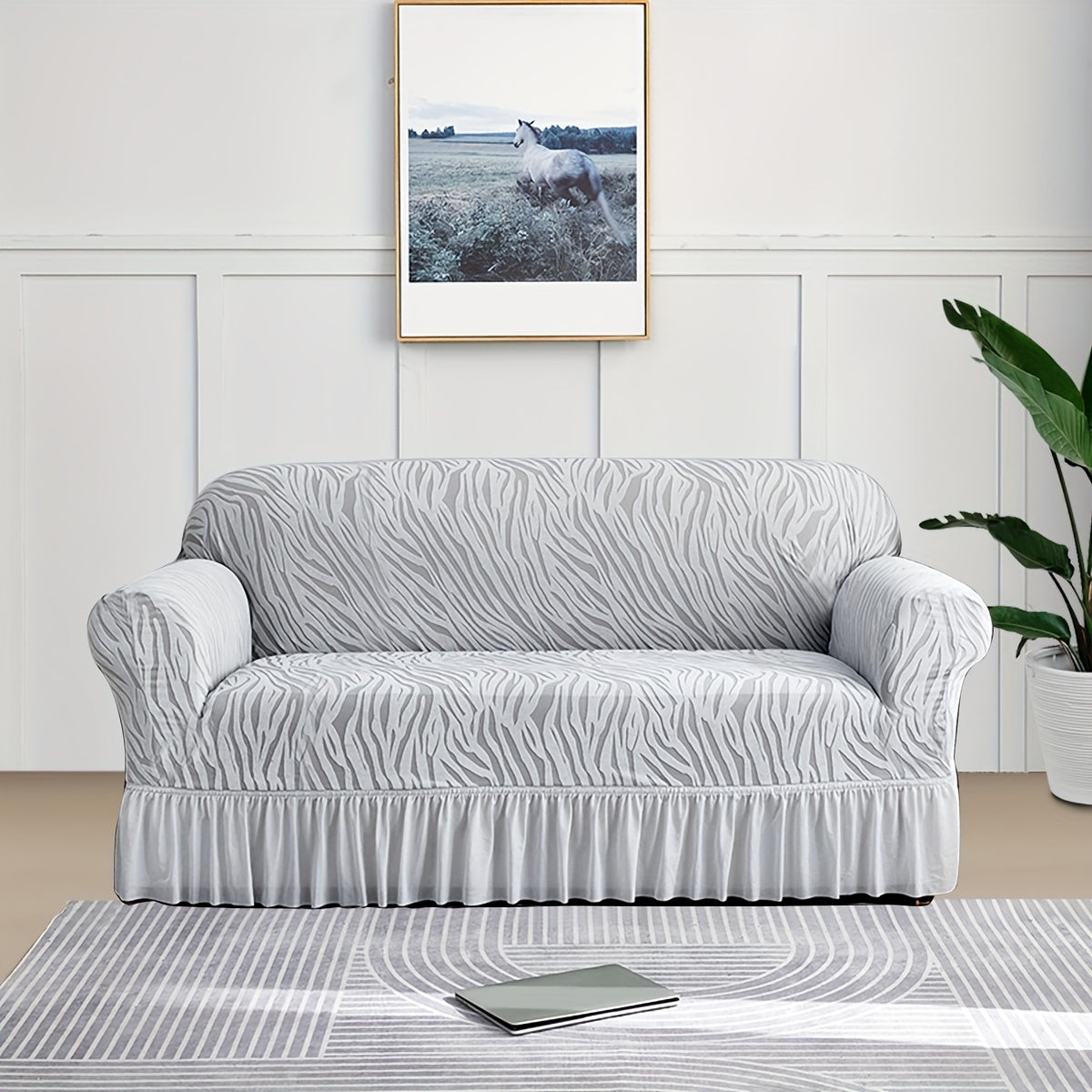 Wave pattern sofa slipcover with skirt, non-slip and dustproof. Protects furniture from cat scratches. Machine washable for easy cleaning. Suitable for bedroom, office, or living room décor.