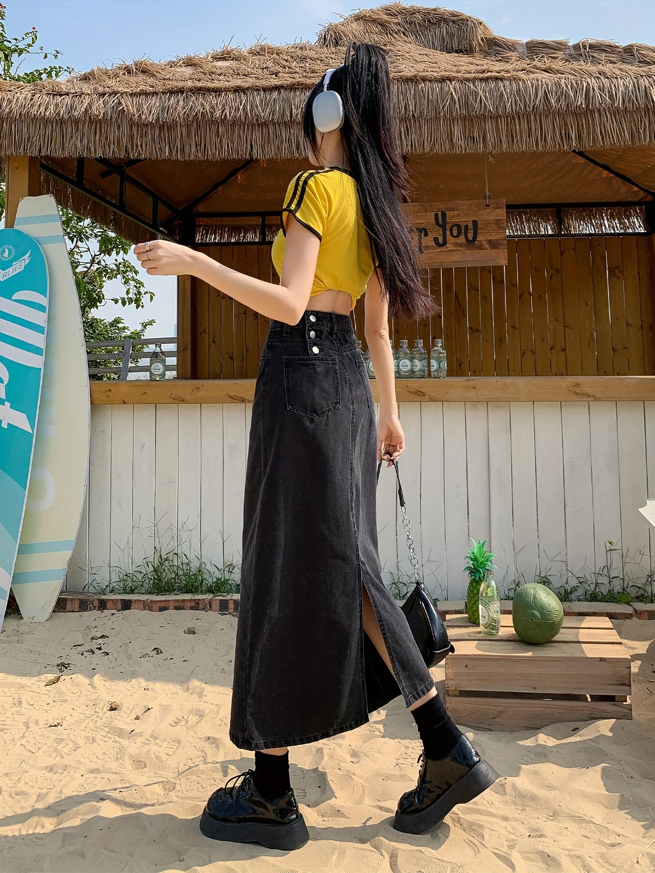 Casual denim midi skirt for women with side slit, mid-rise waist, straight cut, solid color, and pockets. Made of 55% cotton and 45% polyester blend.