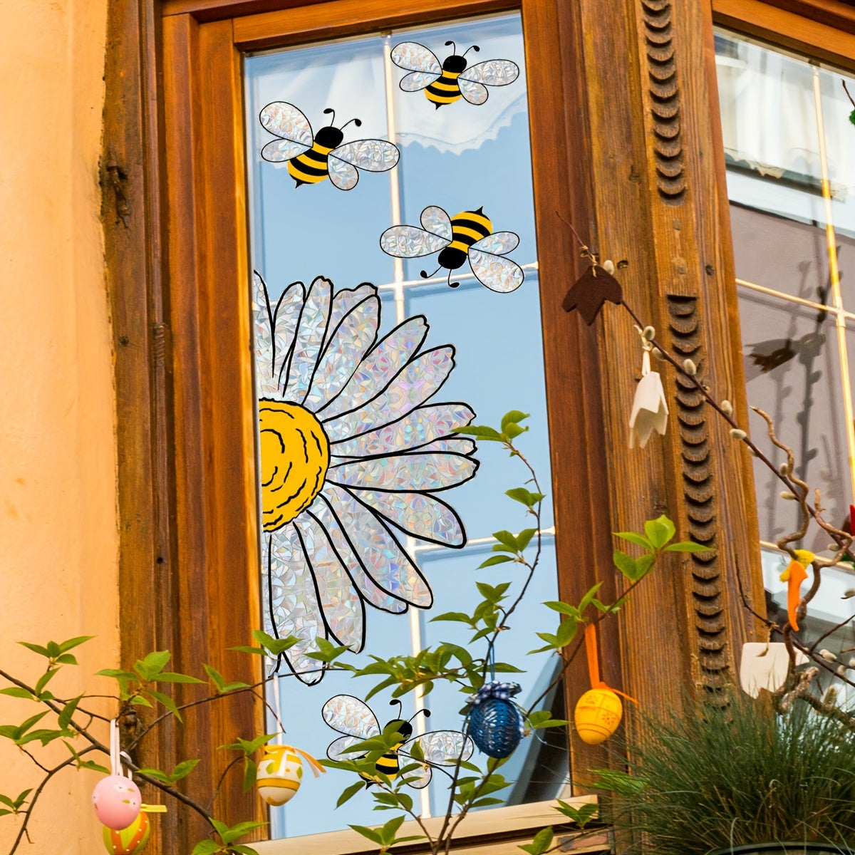 Bring a touch of spring to your home with this Sunflower & Bee Window Cling! Measuring 30.48cm x 40.64cm, this reusable electrostatic glass decal features double-sided colorful designs that make perfect home decor accents.