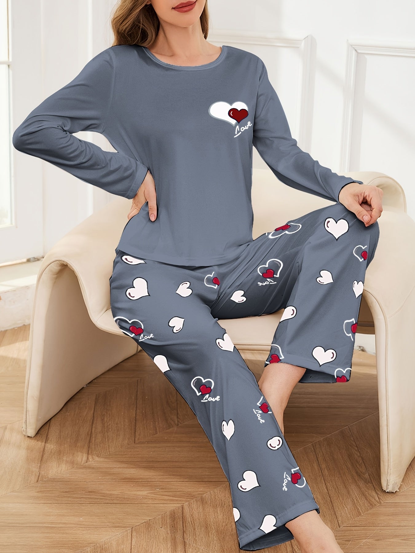 Women's pajama set for sleepwear and loungewear, featuring heart print, long sleeves, round neck top, and long pants for autumn and winter.