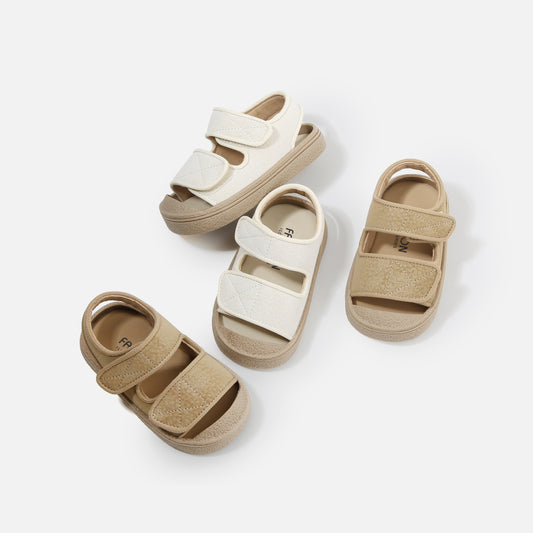 Kids' breathable open-toe footwear with hook-and-loop closure, perfect for beach and leisure activities.