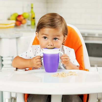 Pink and white leak-proof training cup with easy-grip handles for young children. Made of durable, lightweight silicone and is handwash recommended.