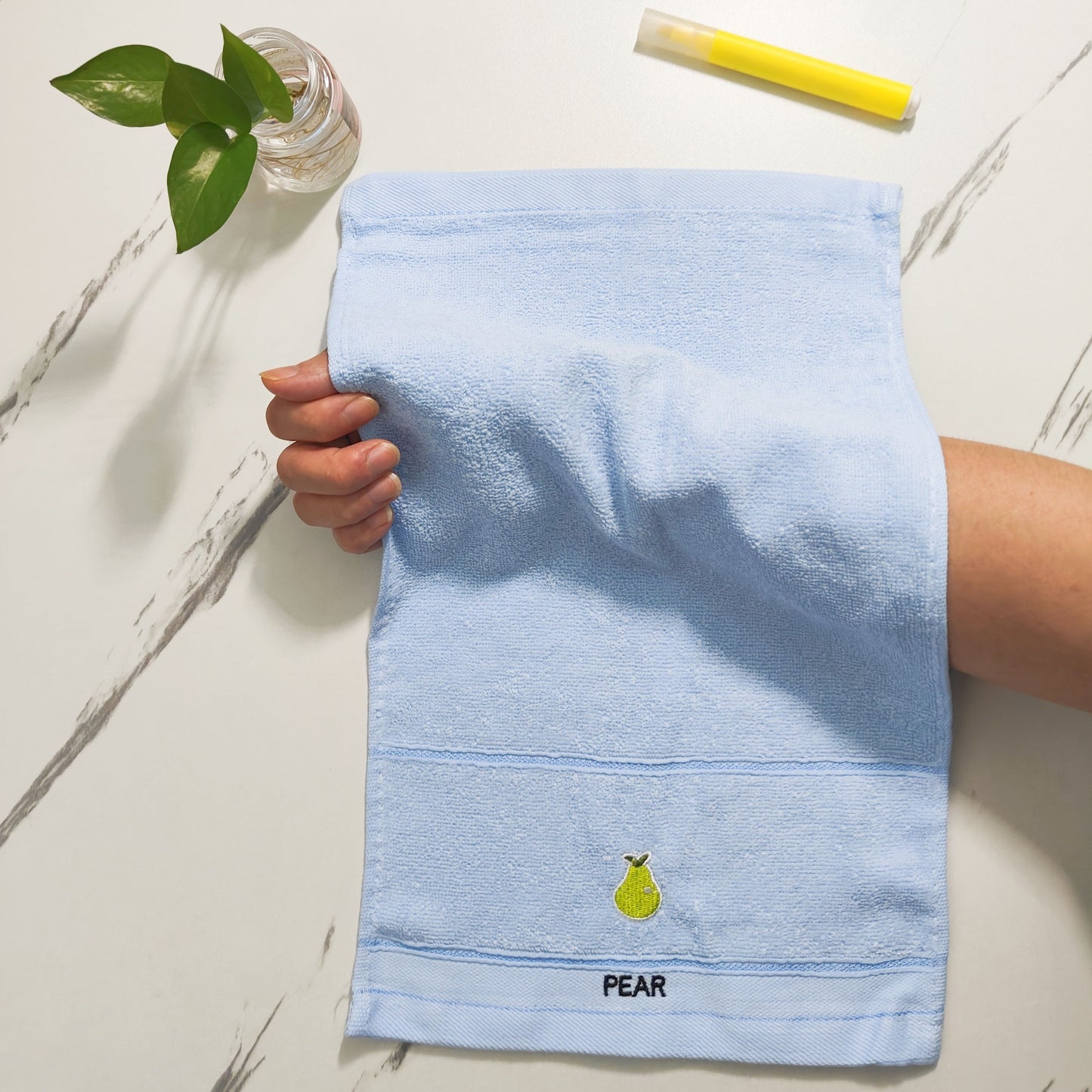 Five soft cotton fingertip towels with fruit patterns ideal for everyday use in the bathroom.