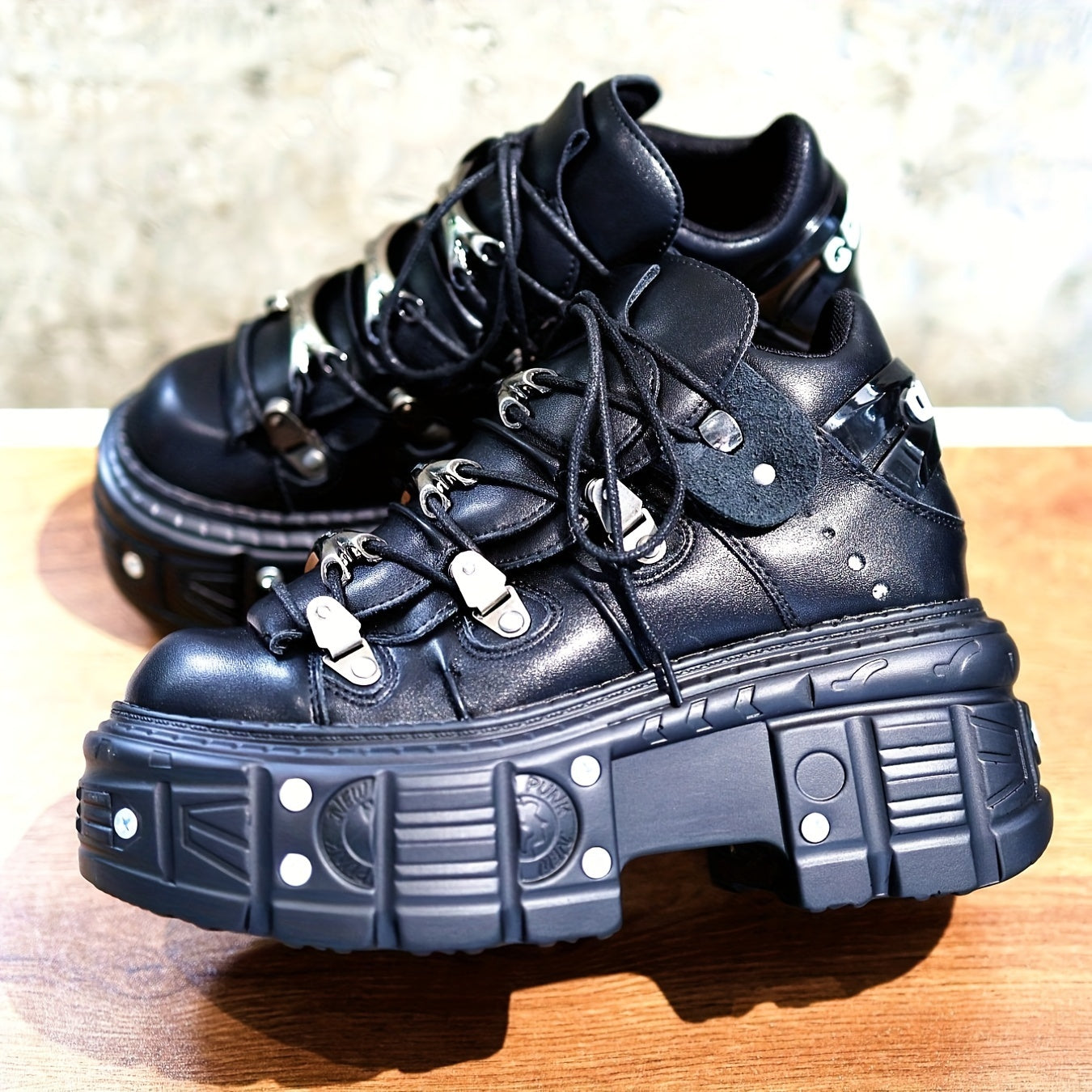 Black women's mid-top sneakers with metallic accents, waterproof, thick platform sole, lace-up Y2K goth style.