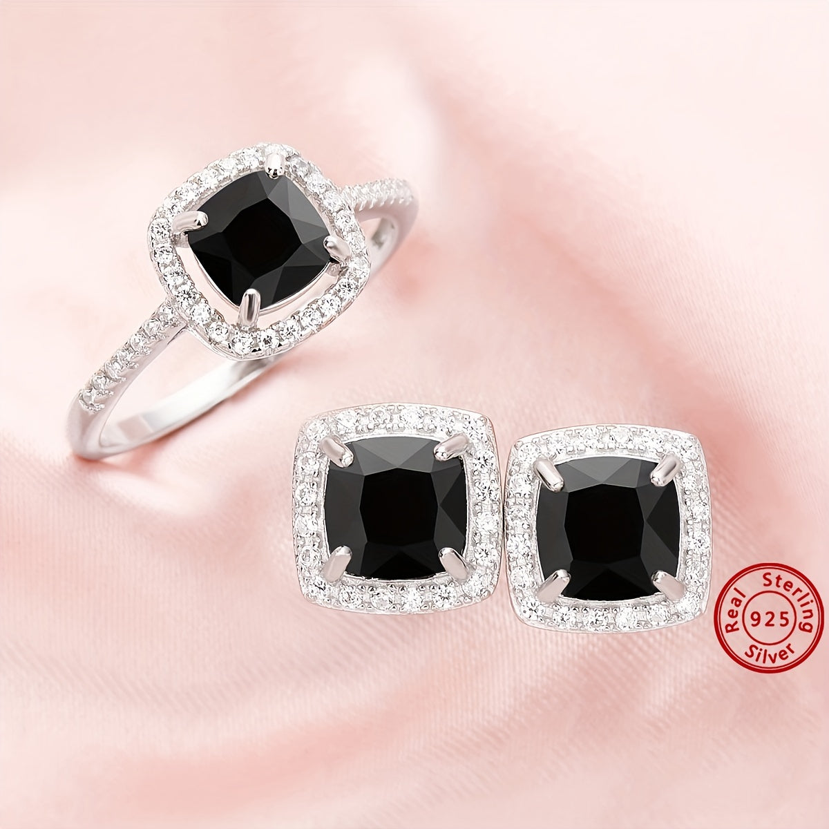 Set of elegant jewelry comprising of three pieces - two earrings and one ring, made of 925 sterling silver and inlaid with black zircon. This set symbolizes romance and mystery, making it perfect for parties and special occasions. The total weight of